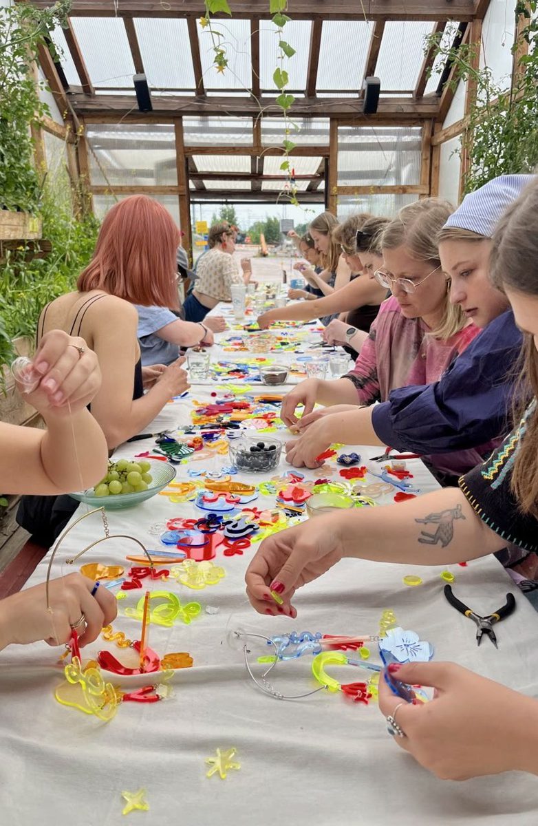 An Idle workshop in a greenhouse, long table covered with acrylic shapes